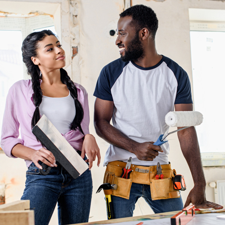 attractive young couple making renovations to their home